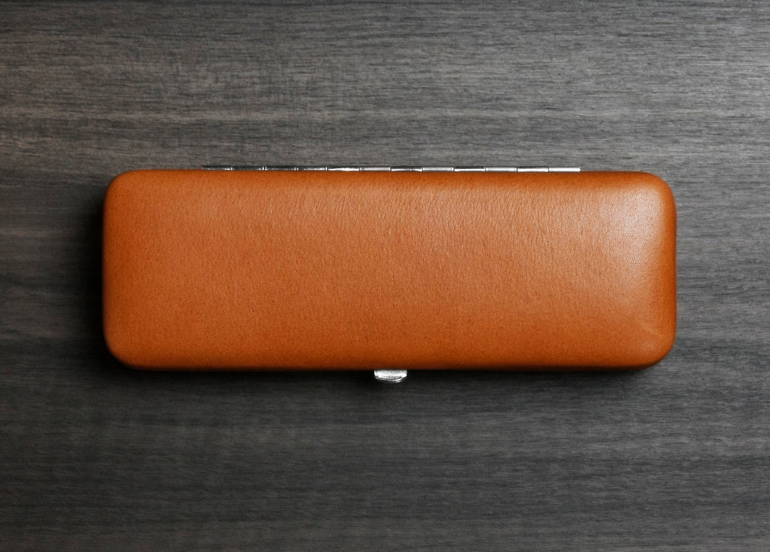 Handmade F. Hammann leather pen case in Coxorange Alpina, representing 160 years of German heritage craftsmanship.