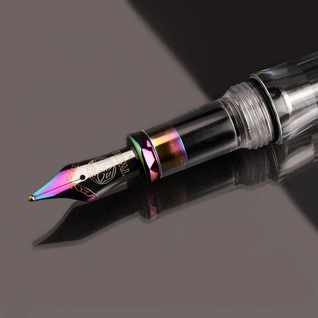 Close-up of TWSBI VAC700R Fountain Pen – Iris's nib on a dark background