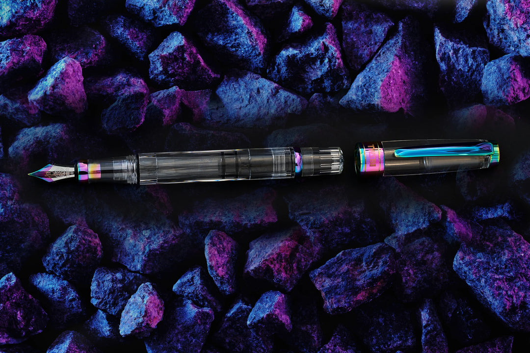 TWSBI Diamond 580 Fountain Pen – Iris on a textured purple and blue surface
