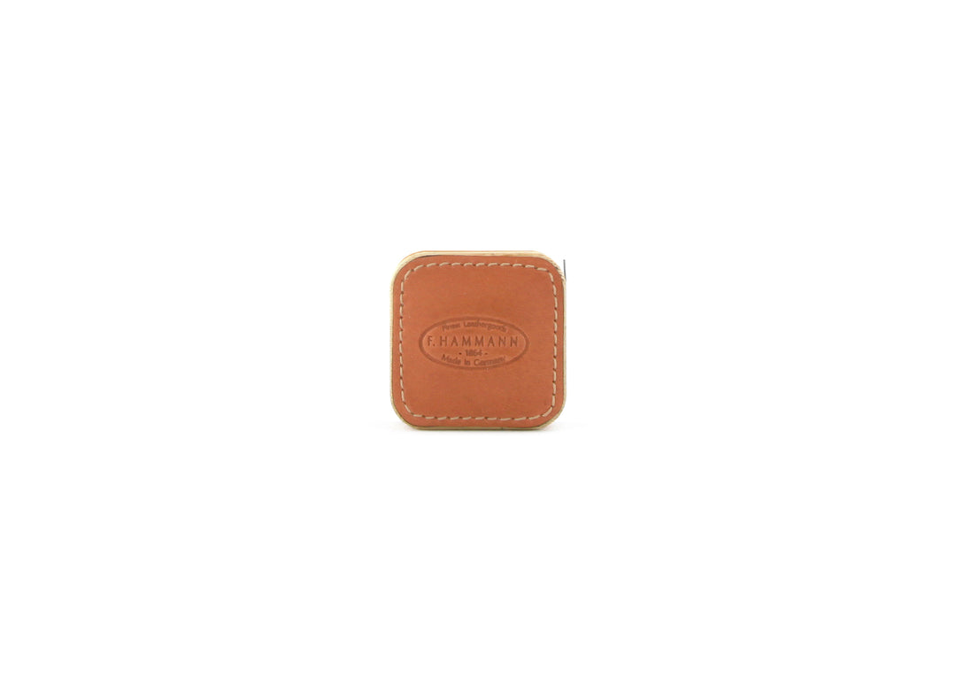 Closed F. Hammann 5205 Leather Tape Measure in Coxorange Alpina, viewed directly on a white background.