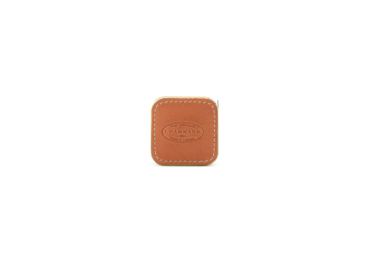 Closed F. Hammann 5205 Leather Tape Measure in Coxorange Alpina, viewed directly on a white background.