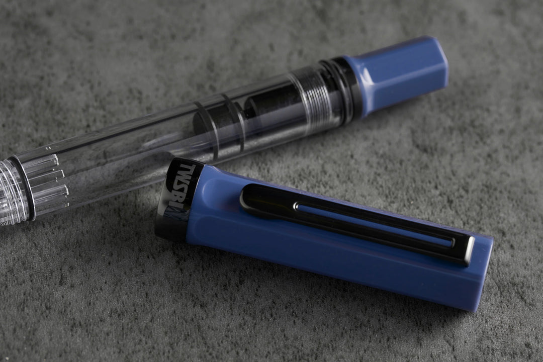 Close up of TWSBI ECO Fountain Pen – Slate Blue Onyx on a gray surface