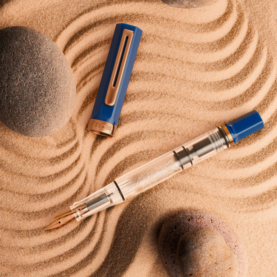 TWSBI ECO Fountain Pen – Indigo Blue Bronze on sand with circular patterns