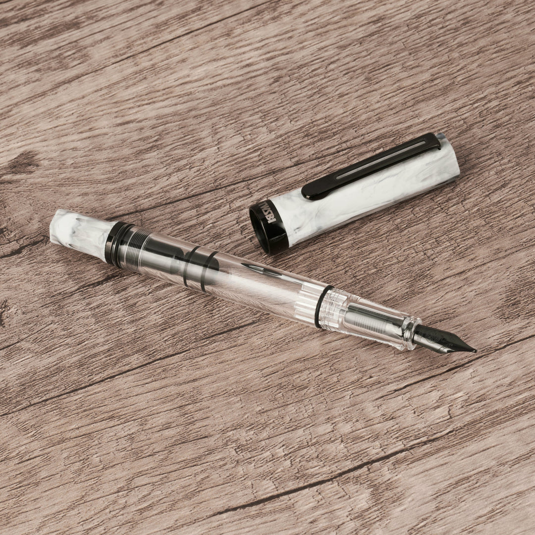 TWSBI ECO Fountain Pen – Carrara Onyx on a wooden surface