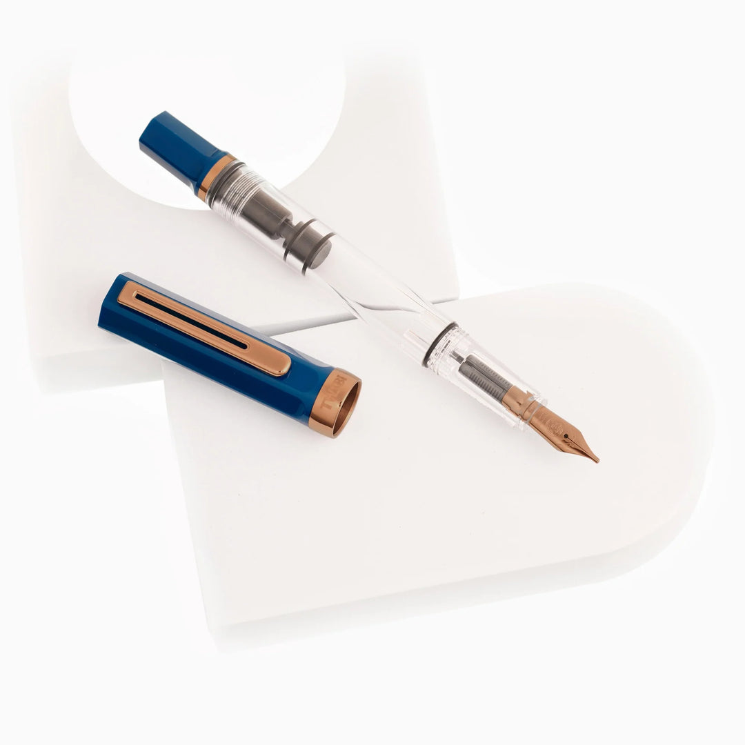 TWSBI ECO Fountain Pen – Indigo Blue Bronze, showing the cap and body on a white plate