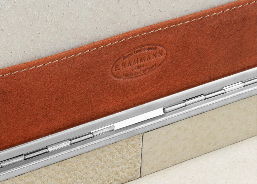 Macro view inside the 3976 Ruler Box detailing the F. Hammann 1864 embossed logo on Coxorange leather and silver hinge.