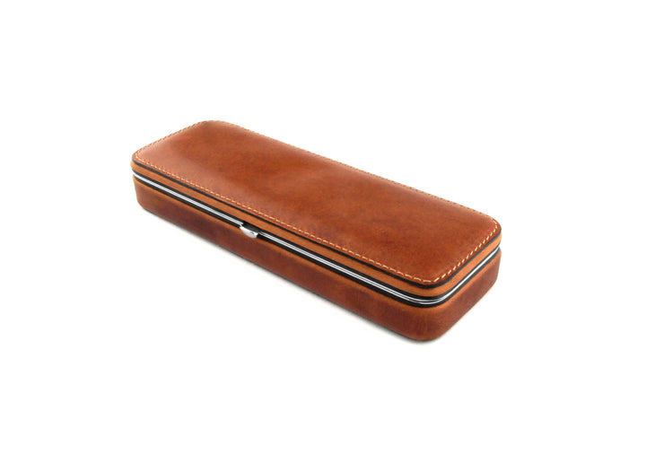 Angled view of the F. Hammann 3983 Framed Pen Case in Coxorange Alpina bullhide, showcasing the rich amber-brown grain and zipperless construction.