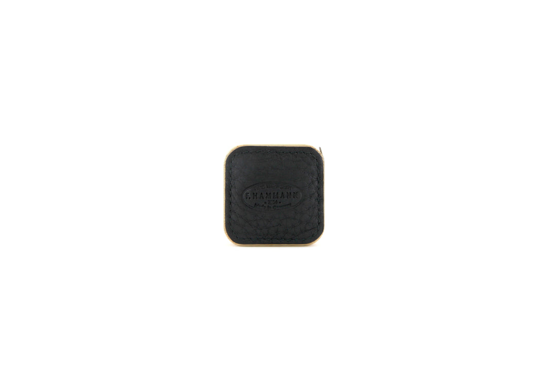 Closed F. Hammann 5205 Leather Tape Measure in textured Black Chervo, viewed directly on a white background.