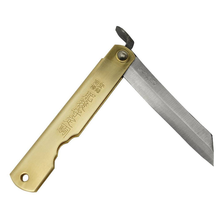 Partially deployed Higonokami friction folder knife highlighting the traditional chikiri thumb lever and solid brass pivot.