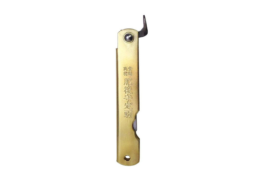Closed profile of the Higonokami Brass M pocket knife featuring authentic Japanese handle engravings and the extended chikiri lever.