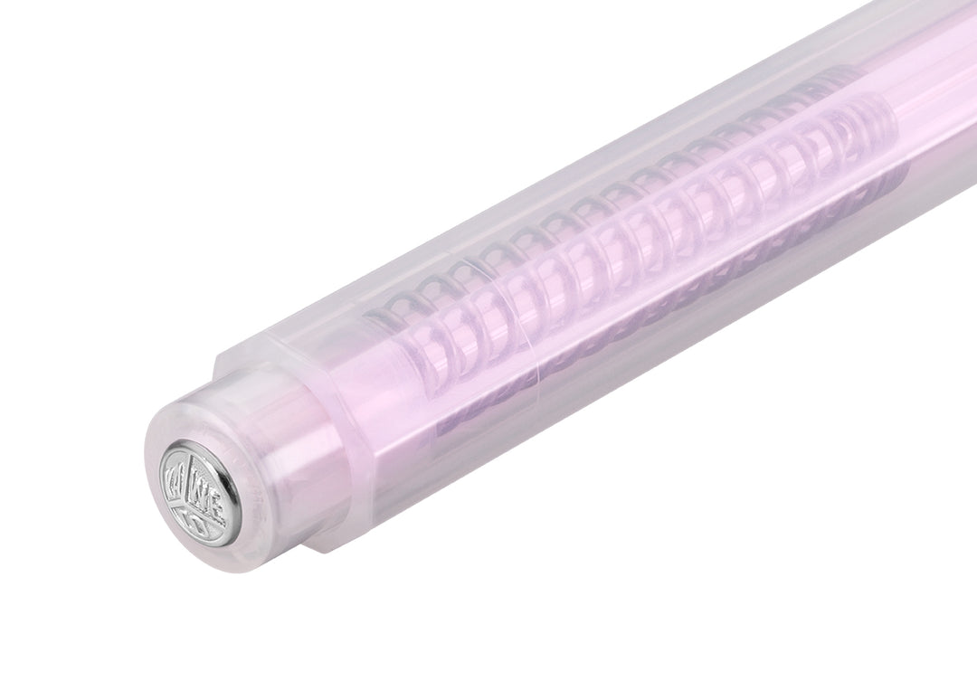 Close-up of the silver Kaweco logo push button on the Kaweco Lunar Sport Clutch Pencil in Light Purple, highlighting the pale, semi-translucent iridescent octagonal barrel.