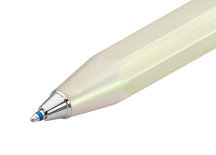 Macro shot of the silver metal cone and blue ballpoint tip extended from the Kaweco Lunar Sport Ballpoint Pen in Light Green.