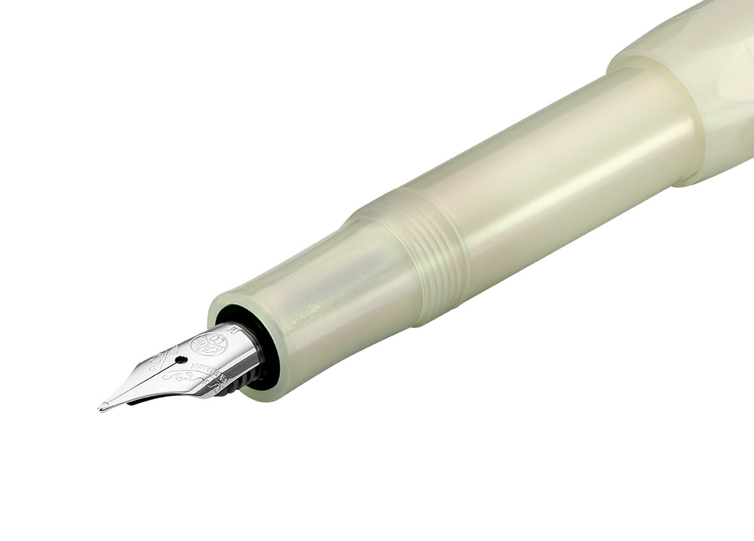 Macro shot of the silver stainless steel 060 nib and grip section on the Kaweco Lunar Sport Light Green.