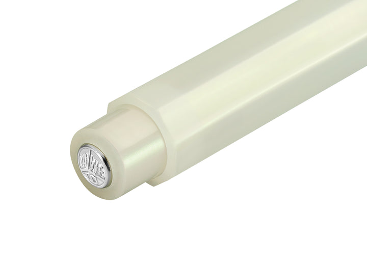 Detail view of the Kaweco Lunar Sport cap finial featuring the silver logo medallion on the shimmering Light Green finish.