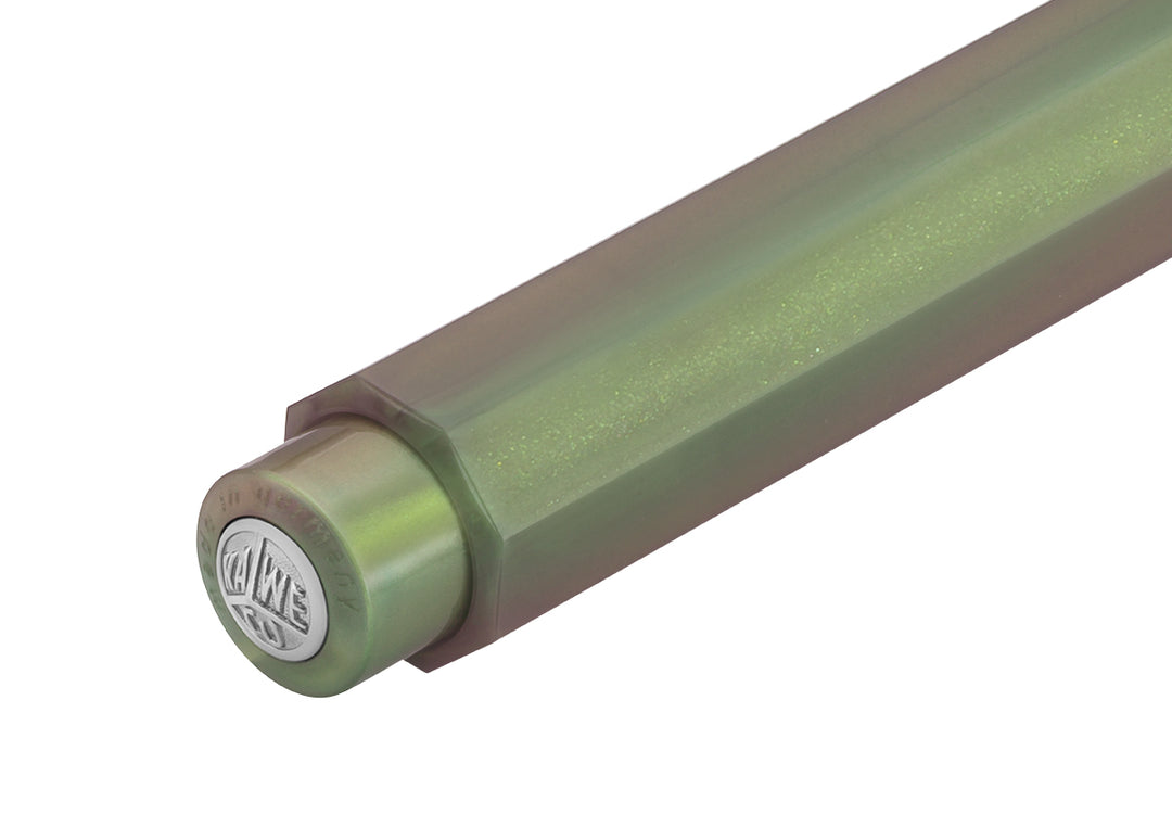 Close-up of Kaweco Lunar Sport Shadow Green push button with silver logo medallion and shimmering finish.