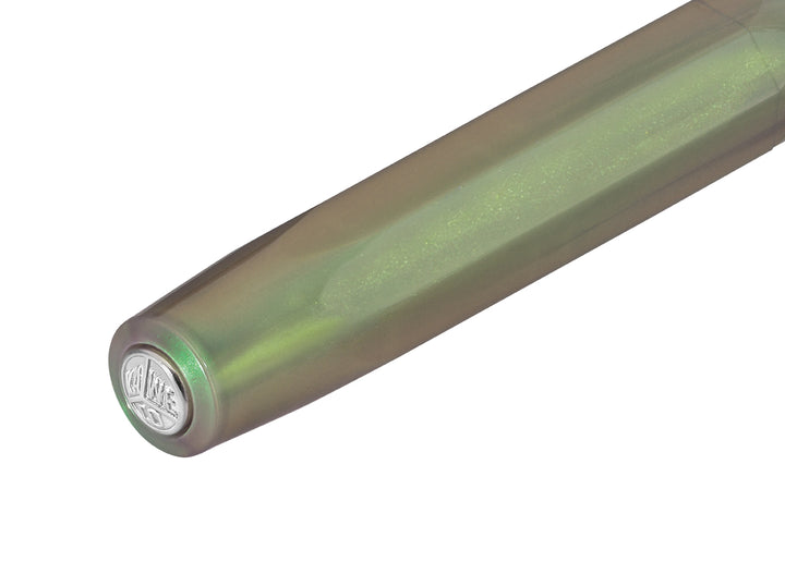 Close-up of the silver Kaweco logo medallion on the top of the Shadow Green octagonal cap.