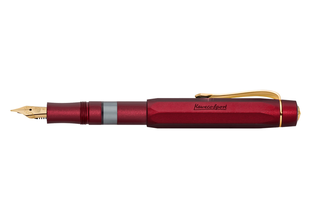 Full view of the Kaweco Piston Sport AL Fountain Pen in Bordeaux posted, highlighting the 190 gold-plated nib, transparent ink window, anodised red aluminium body, and gold clip.
