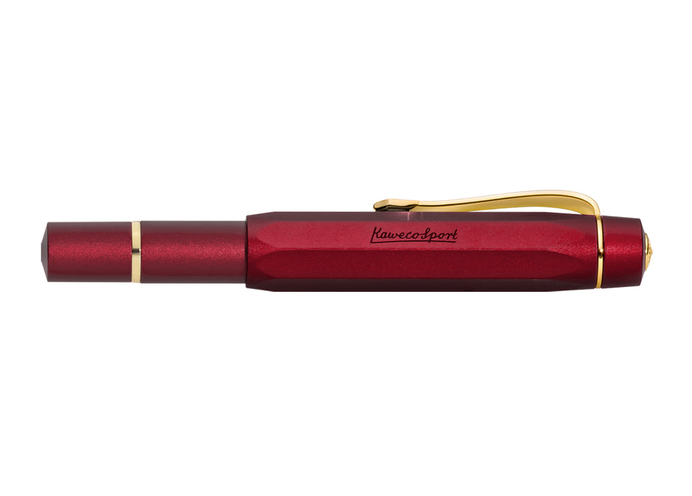 Kaweco Piston Sport AL Fountain Pen in Bordeaux closed, showing the gold Kaweco logo finial, built-in gold clip, and octagonal anodised red aluminium cap.