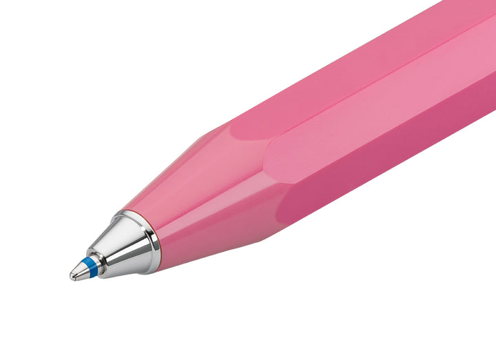 Macro shot of Kaweco Skyline Sport Pink ballpoint tip extended showing Blue 1.0mm ink refill.