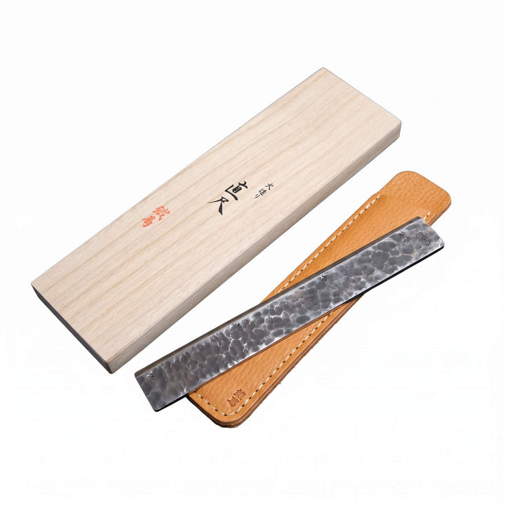 170mm Kurogane Kazura Hand-Forged Ruler with its natural tan leather case and paulownia wooden gift box.
