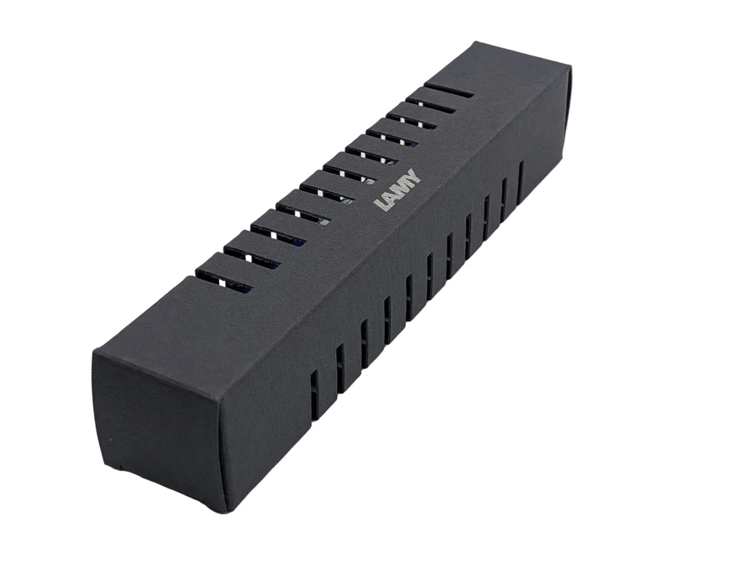 Official LAMY matte black rectangular cardboard presentation box featuring the silver LAMY logo and distinctive slotted cutouts, used for retail packaging.