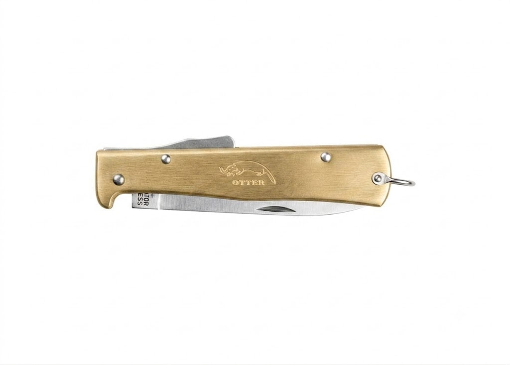 Otter Mercator Brass Pocket Knife in the closed position, illustrating its solid brass finish, slim profile, and practical lanyard ring for everyday carry.