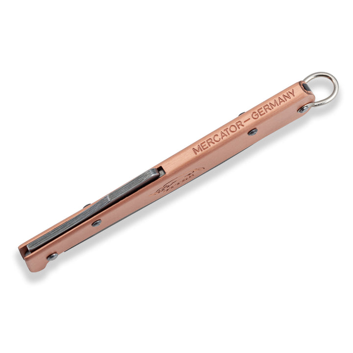 Top spine view of the Otter Mercator Copper EDC knife, highlighting the secure backlock mechanism and Mercator Germany engraving.