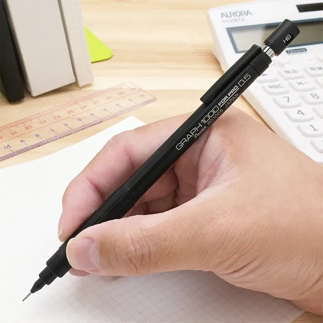 Hand writing with the stealth black Pentel Graph 1000 Anniversary Edition PG1005-ANA 0.5mm drafting pencil.