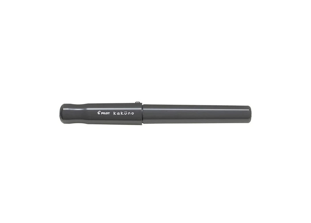 Pilot Kakuno Grey fountain pen with black cap and white ergonomic body.