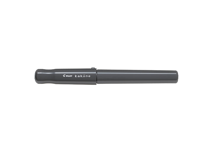 Pilot Kakuno Grey fountain pen with black cap and white ergonomic body.