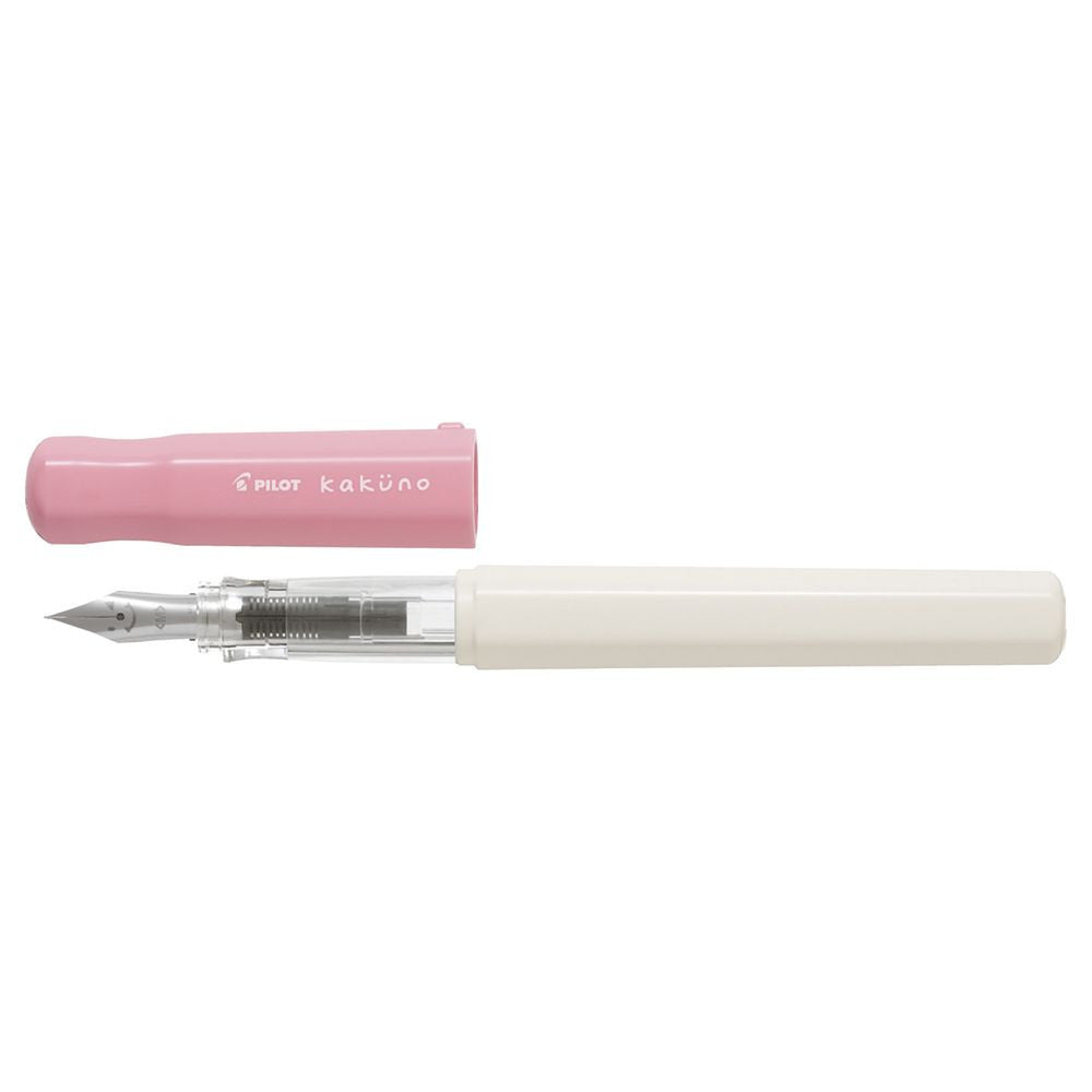 Uncapped Pilot Kakuno Soft Pink fountain pen showing the triangular grip and classic smiley face steel nib.