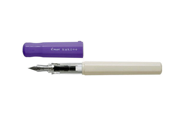 Uncapped Pilot Kakuno Soft Violet fountain pen showing the triangular grip and classic smiley face steel nib.