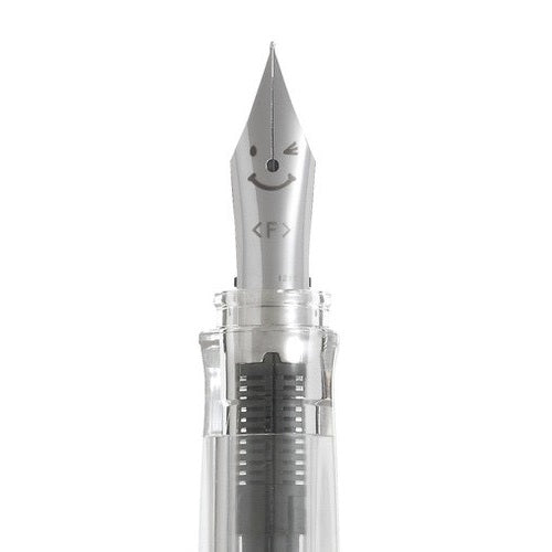 Detail view of the Pilot Kakuno Soft Yellow classic smiley face nib engraving on a steel nib.