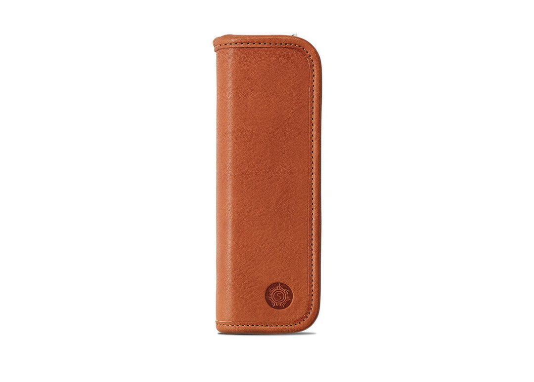 Front view of the Sonnenleder Grass Pen Case in Natural "Old Germany" leather featuring the iconic circular sun embossed logo at the bottom.