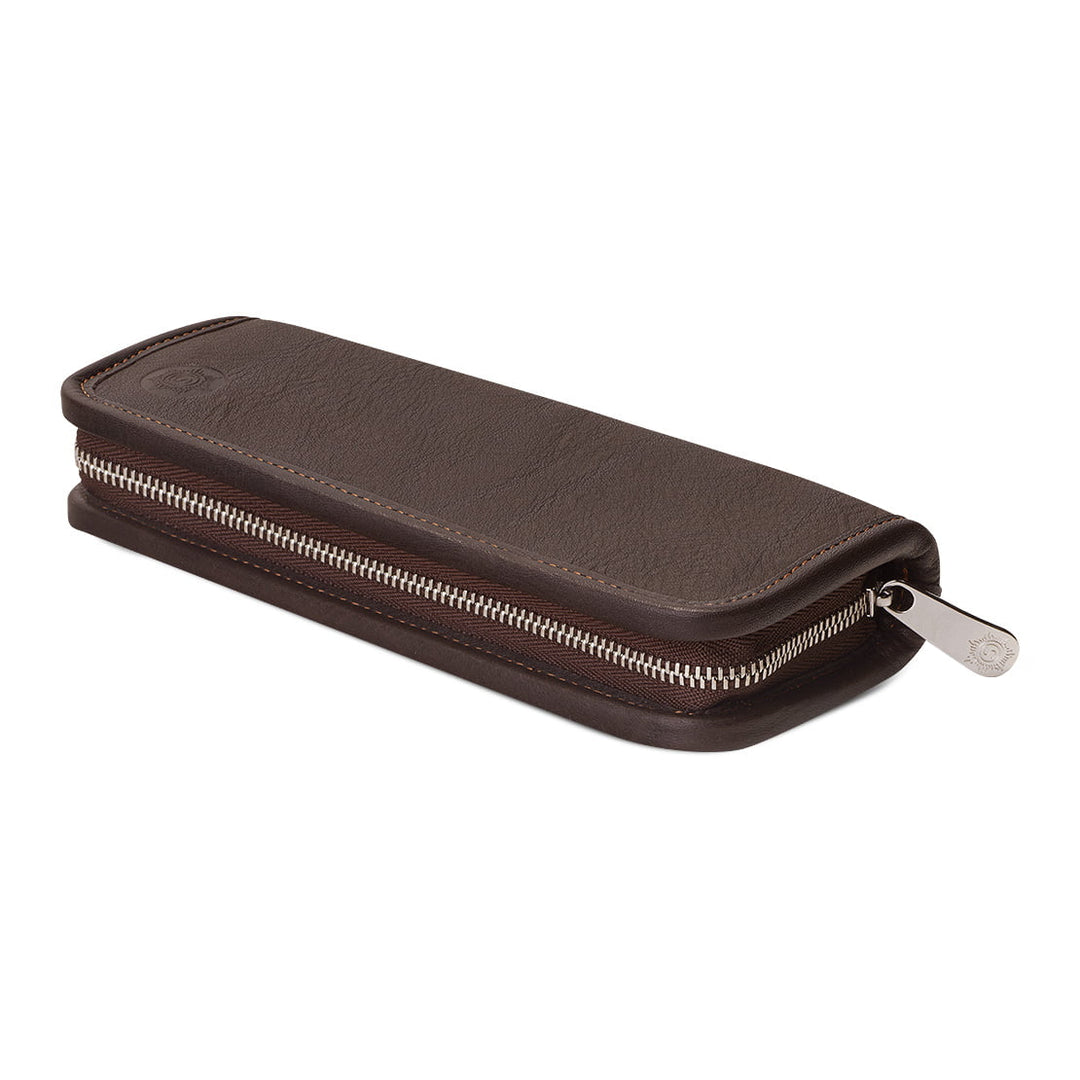 Angled profile of the closed Sonnenleder Mörike Leather Pen Case in Mocha Brown, highlighting the slim heritage design and premium polished silver-tone metal zipper.