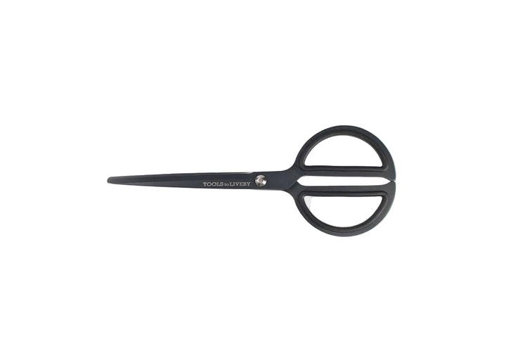 TOOLS to LIVEBY 8-inch matte black scissors closed and resting horizontally on a minimalist white background, showcasing the sleek Japanese stainless steel profile and anti-glue Teflon coating.