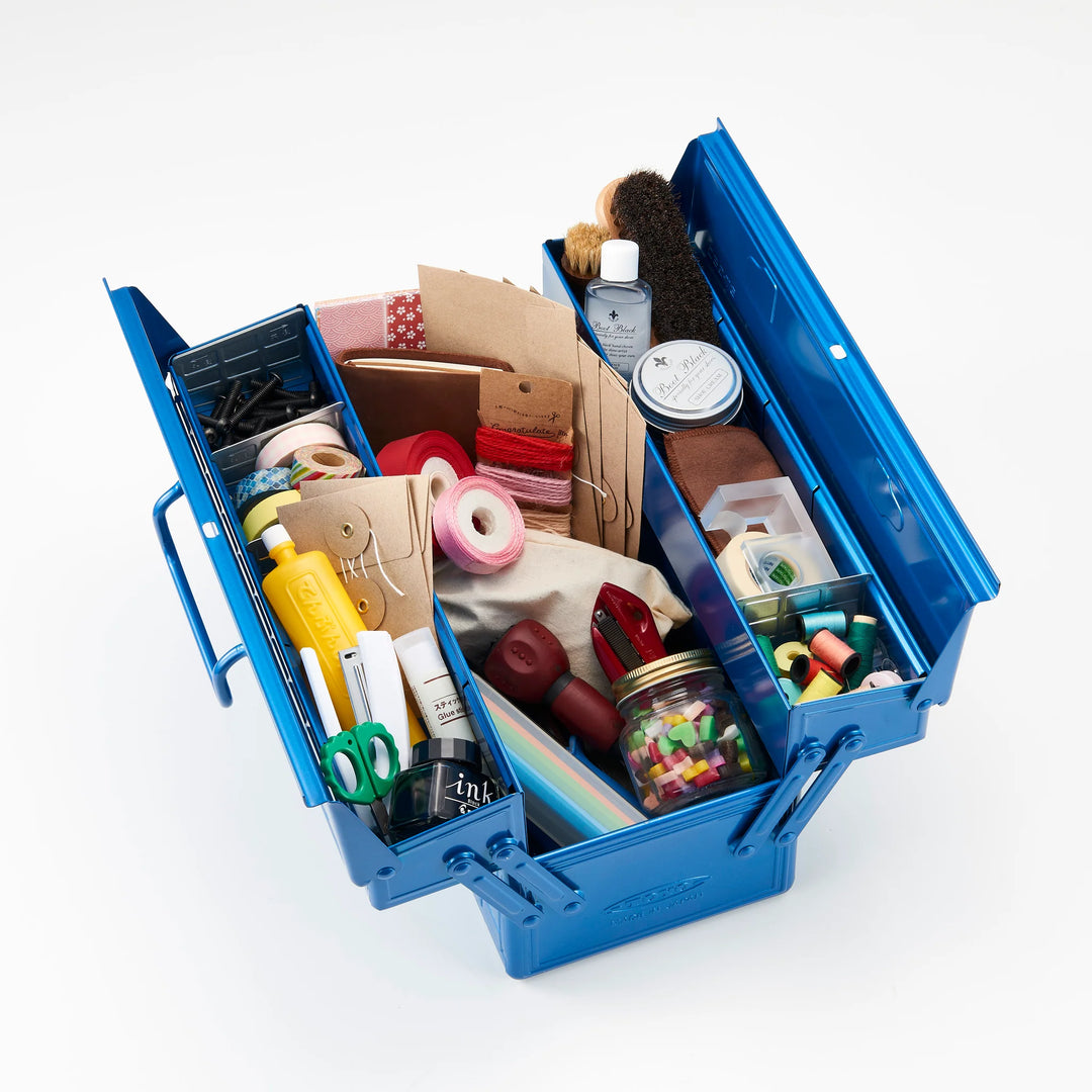 Open Blue TOYO ST-350 Cantilever Toolbox used as a craft storage organizer, filled with ink bottles, washi tape, and art supplies.