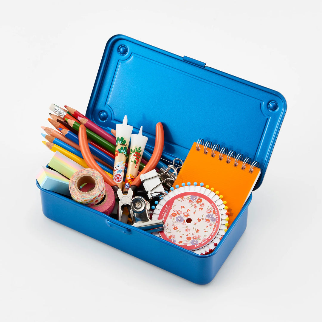 Open Blue TOYO T-190 Steel Toolbox tightly organizing colored pencils, notebooks, binder clips, and craft supplies.