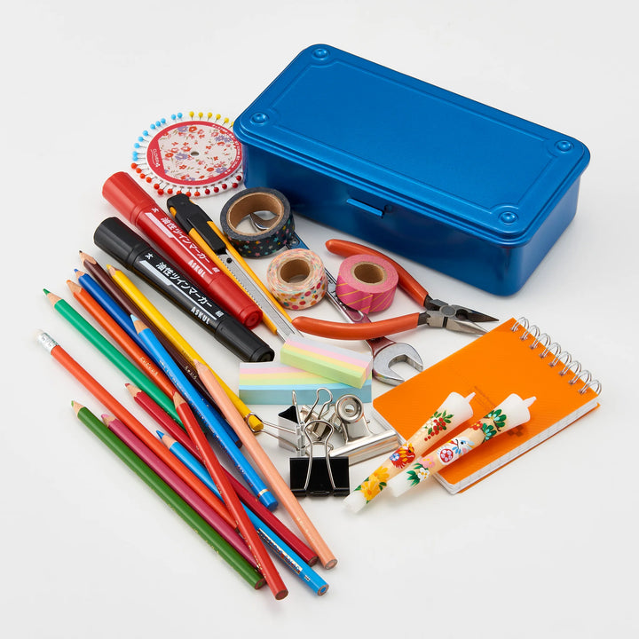 Blue TOYO T-190 Steel Toolbox surrounded by scattered stationery, art supplies, hand tools, and colorful markers.