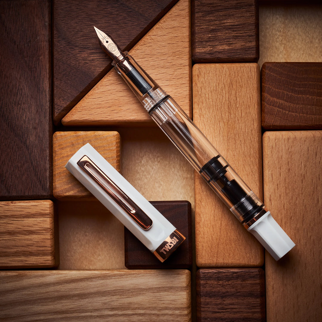TWSBI ECO Fountain Pen – White Rose Gold on a wooden surface