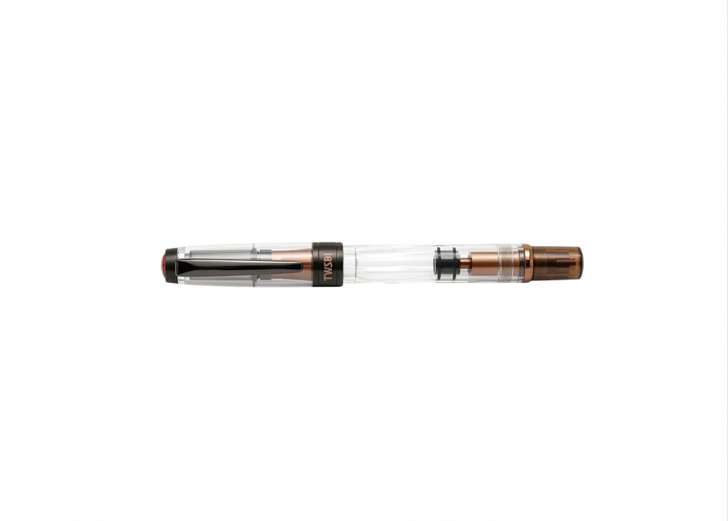 Horizontal profile of the fully capped TWSBI Diamond 580ALR Affogato fountain pen on a pure white background, highlighting the sleek black titanium trim, clear demonstrator barrel, and warm matte brown aluminum accents.