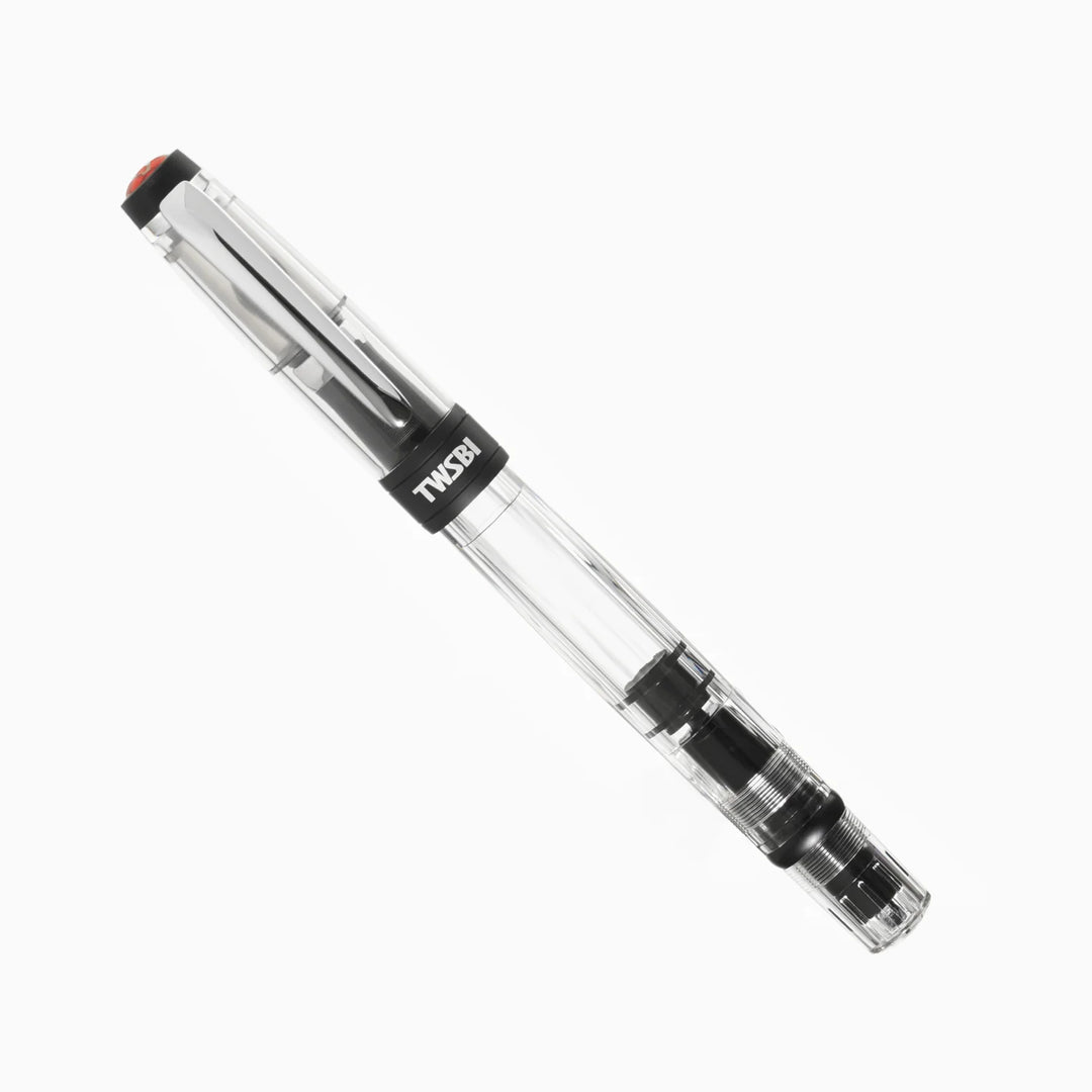 Angled view of the fully capped TWSBI Diamond 580ALR Black fountain pen on a white background, showing the clear faceted demonstrator barrel, matte black anodized aluminum trim, and polished silver clip.