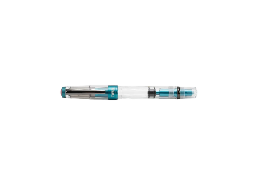 Horizontal profile of the fully capped TWSBI Diamond 580ALR Caribbean Blue fountain pen resting on a clean white background, displaying the cohesive design of the clear barrel, black titanium clip, and blue aluminum piston knob.