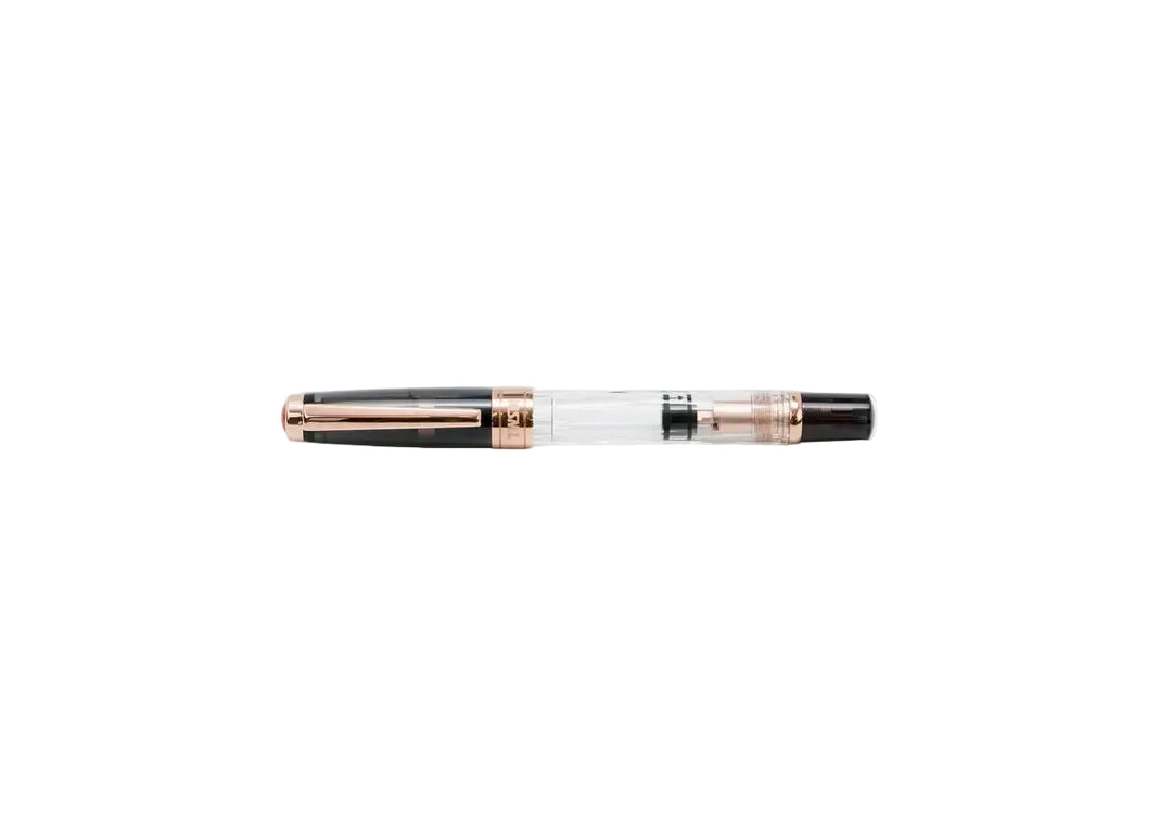 TWSBI Diamond 580 Smoke RoseGold II fountain pen shown capped, highlighting the clear faceted demonstrator barrel, translucent smoke resin cap, and luxurious rose gold-plated trim against a white background.