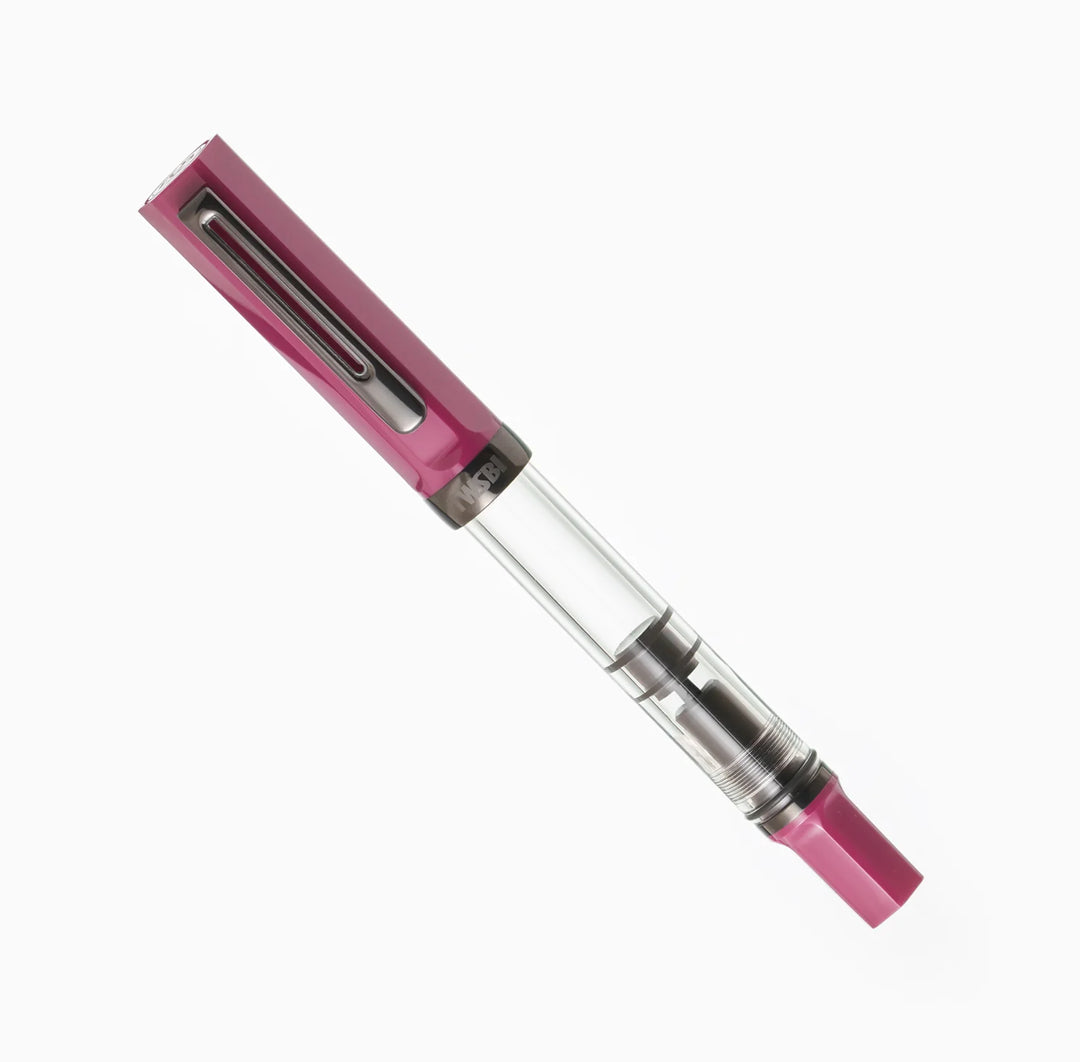 Angled product photograph of the fully capped TWSBI ECO Plum Onyx fountain pen on a pure white background. The image clearly displays the striking contrast between the rich plum purple cap and piston knob, the stealthy dark onyx-plated pocket clip, and the clear ink barrel.