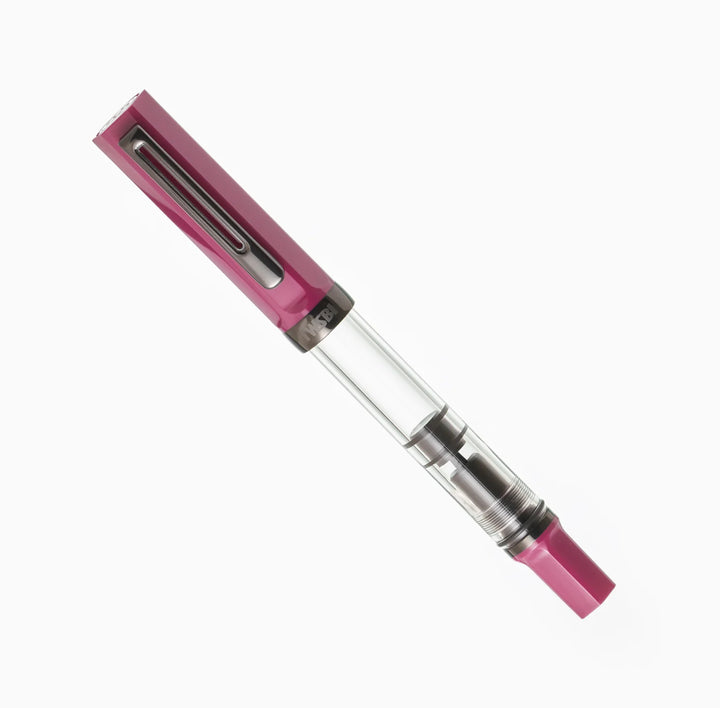 Angled product photograph of the fully capped TWSBI ECO Plum Onyx fountain pen on a pure white background. The image clearly displays the striking contrast between the rich plum purple cap and piston knob, the stealthy dark onyx-plated pocket clip, and the clear ink barrel.