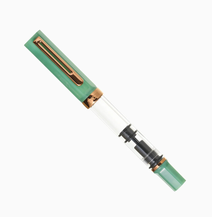 Capped TWSBI ECO Jade Jelly Bronze fountain pen, diagonal full-length view showing the clear demonstrator barrel and bronze trim on a white background.