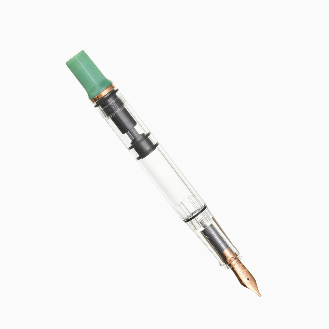 TWSBI ECO Jade Jelly Bronze piston-filler fountain pen, full-length diagonal view with the translucent green cap securely posted on a pure white background.
