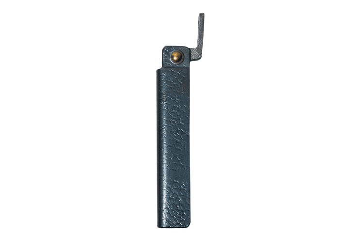 Profile view of the closed large Tomita Higo friction folder, highlighting the hand-forged black hammered iron handle and brass pivot.