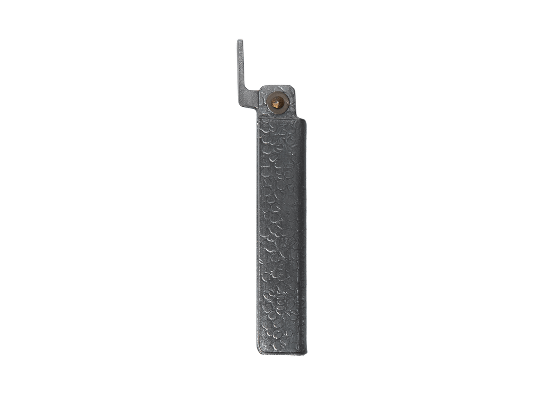 Profile view of the closed Tomita Higo friction folder, highlighting the hand-forged silver hammered iron handle and brass pivot.